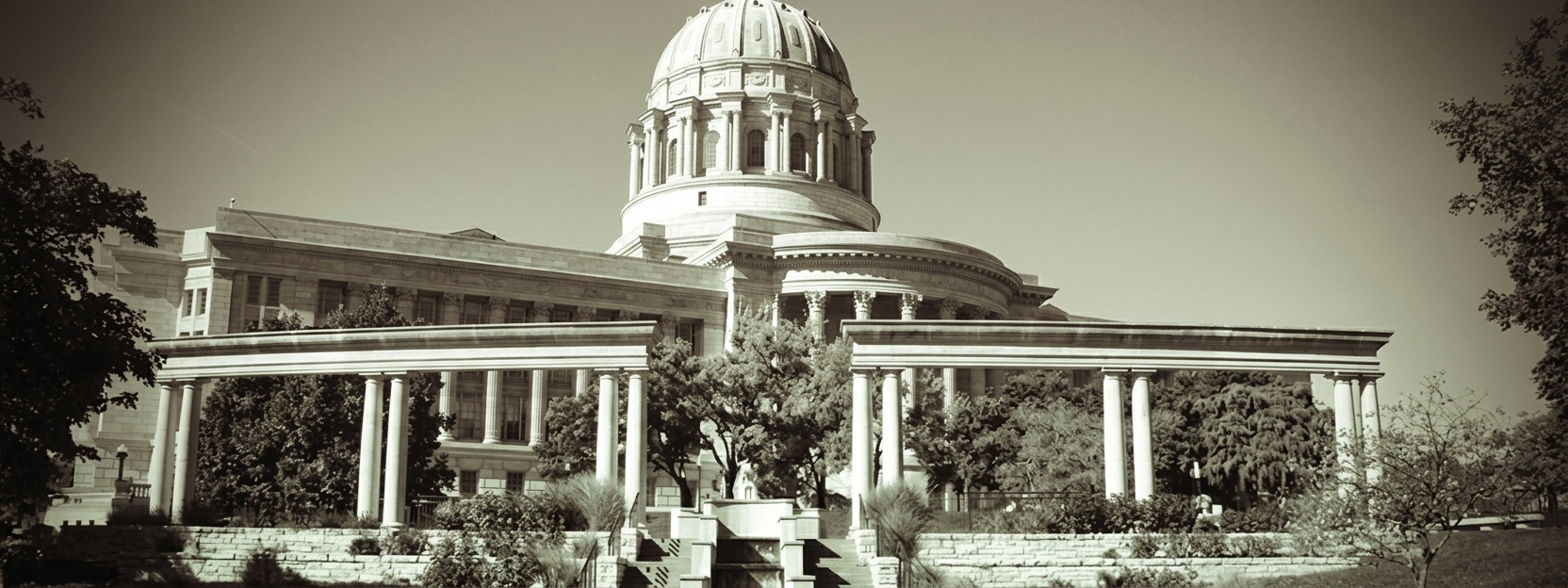 Missouri State Capitol building with columns and dome.